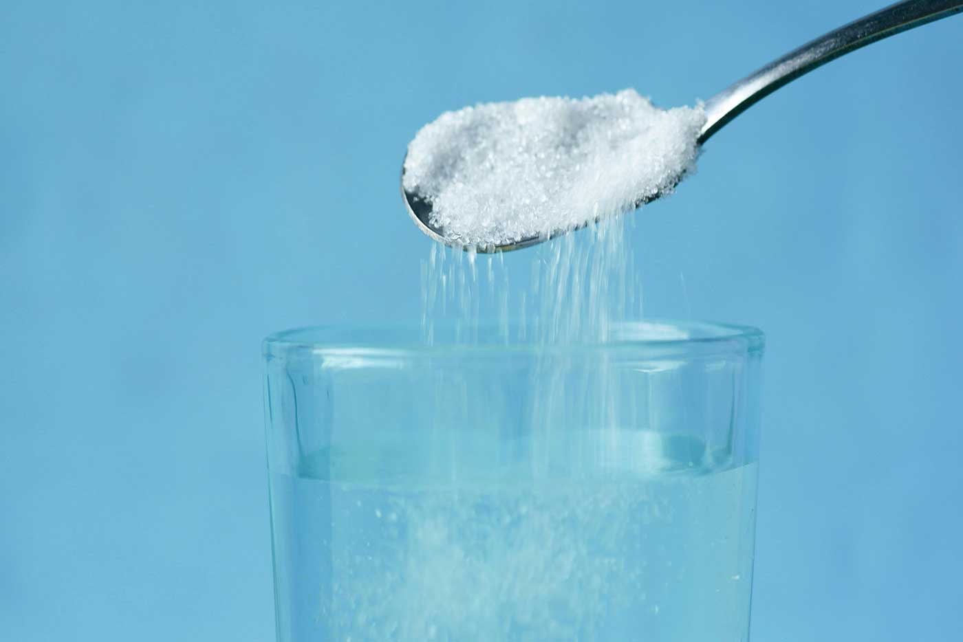 Adding salt it a glass of water