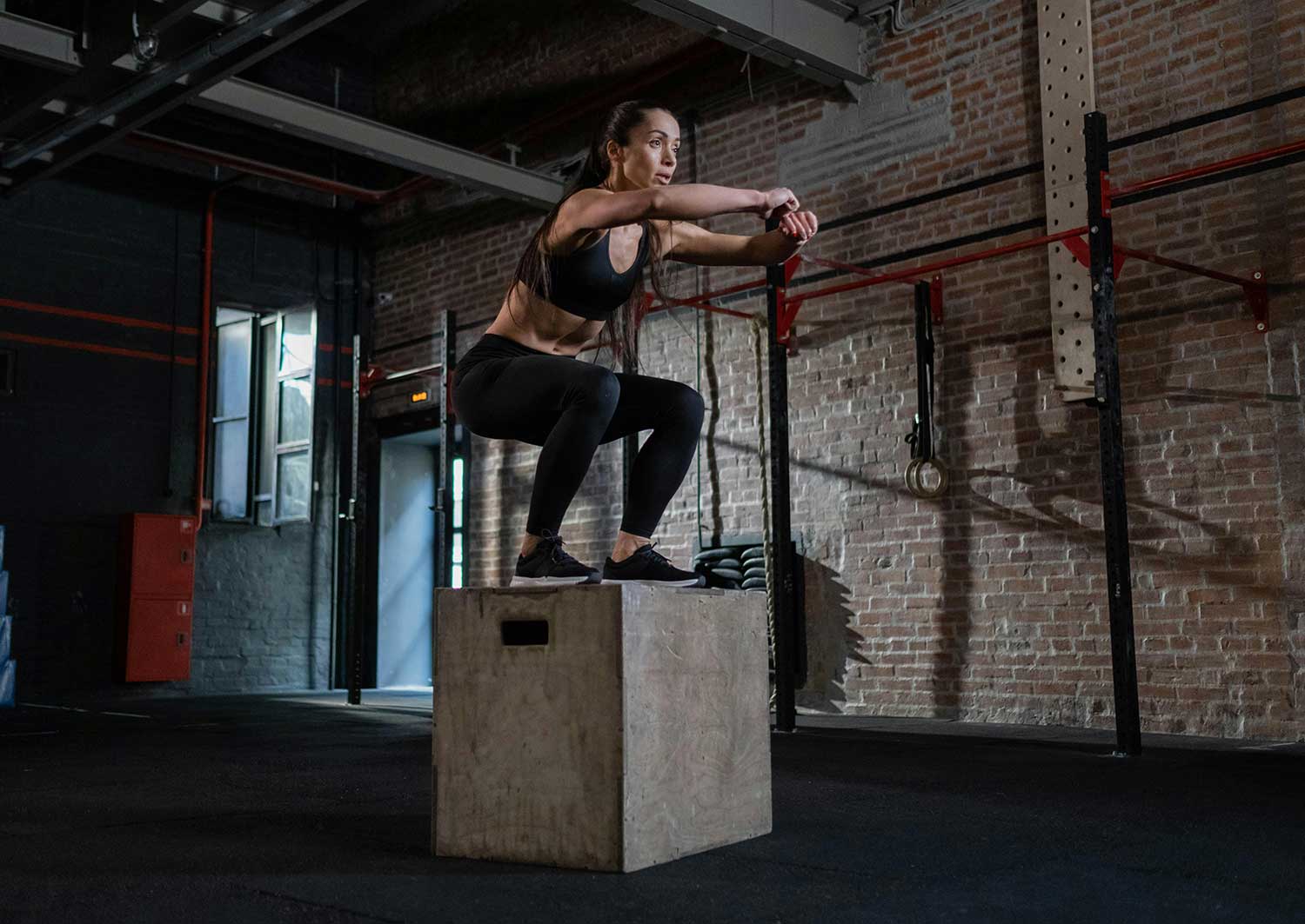 Female doing step ups during HIIT training