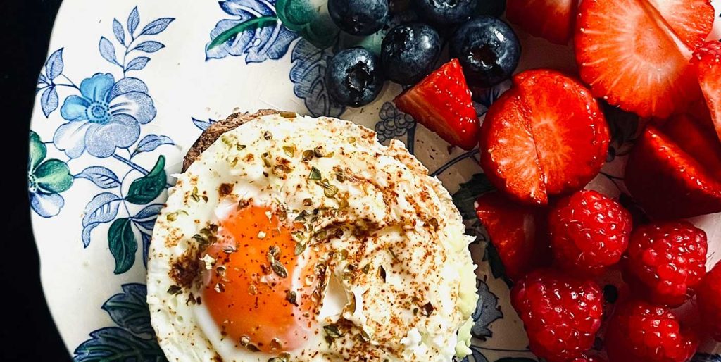 A protein-rich breakfast with eggs and fruit.